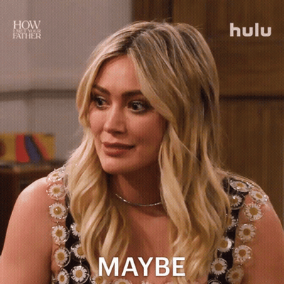 A Woman In A Floral Dress Says Maybe In Front Of A Hulu Logo GIF