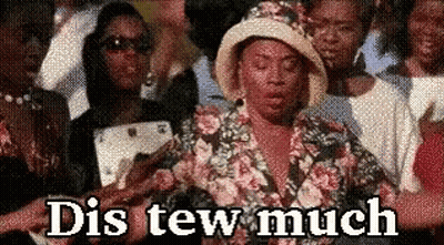 A Woman In A Floral Shirt And Hat Is Standing In A Crowd Of People And Says Dis Tew Much . GIF