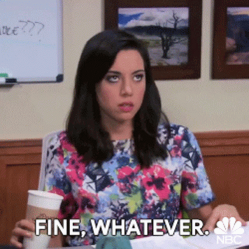 A Woman In A Floral Shirt Is Holding A Cup Of Coffee And Says Fine Whatever GIF