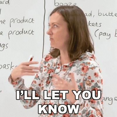 A Woman In A Floral Shirt Says " I 'Ll Let You Know " In Front Of A Whiteboard GIF
