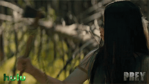 A Woman In A Forest With The Word Prey On The Bottom GIF
