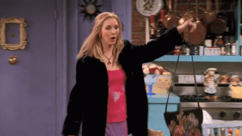 A Woman In A Fur Coat Is Holding A Purse In Her Hand GIF
