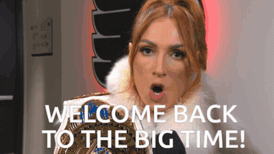 A Woman In A Fur Coat Is Holding A Wrestling Championship Belt And Says Welcome Back To The Big Time GIF