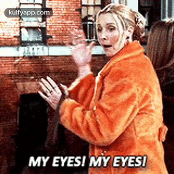 A Woman In A Fur Coat Is Standing In Front Of A Brick Building And Saying `` My Eyes ! My Eyes ! '' GIF