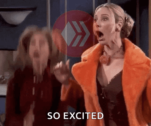 A Woman In A Fur Coat Says So Excited Next To Another Woman GIF
