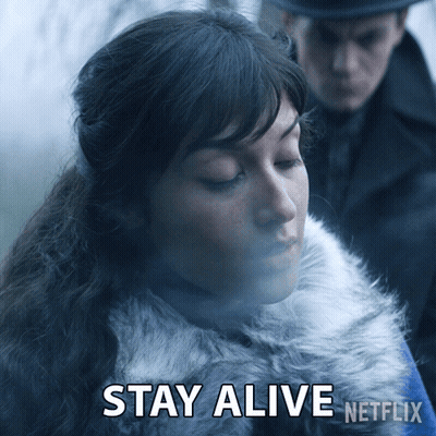 A Woman In A Fur Coat Says " Stay Alive " In A Netflix Ad GIF