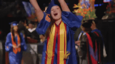 A Woman In A Graduation Cap And Gown With The Number 80 On Her Shirt GIF