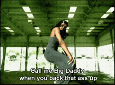 A Woman In A Gray Dress Is Squatting Down With The Words Call Me Big Daddy When You Back That Ass Up GIF