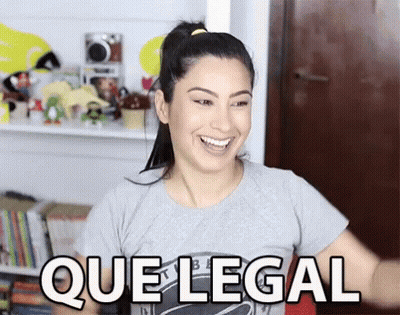 A Woman In A Gray Shirt Is Smiling And Says Que Legal GIF