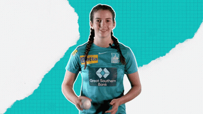 A Woman In A Great Southern Bank Shirt Holds A Baseball GIF