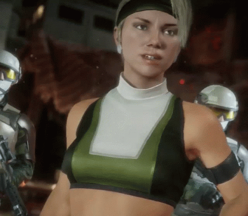 A Woman In A Green And Black Crop Top Stands In Front Of A Robot GIF