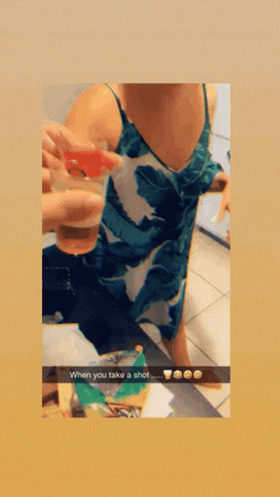 A Woman In A Green And White Leaf Print Dress Is Taking A Selfie With A Caption That Says When You Fake A Shot GIF
