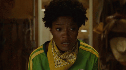 A Woman In A Green And Yellow Shirt Says We Got It In White Letters GIF