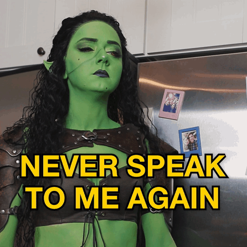 A Woman In A Green Costume With The Words Never Speak To Me Again GIF