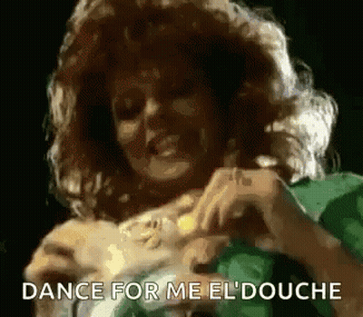 A Woman In A Green Dress Is Dancing With The Words Dance For Me El Douche Above Her GIF