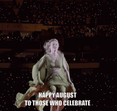 A Woman In A Green Dress Is Dancing With The Words Happy August To Those Who Celebrate GIF