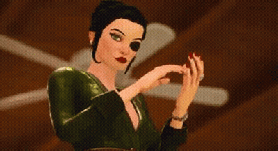 A Woman In A Green Dress With Red Nails Is Clapping Her Hands . GIF