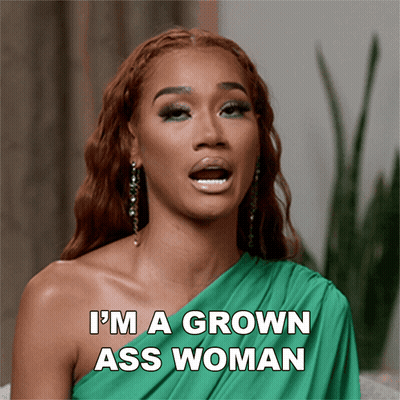A Woman In A Green Dress With The Words I 'M A Grown Ass Woman Above Her GIF