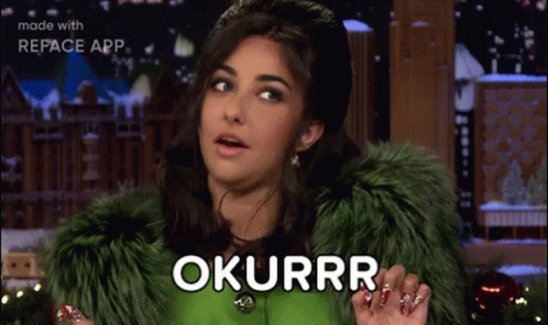 A Woman In A Green Fur Coat Is Making A Funny Face And Saying Okurrr . GIF