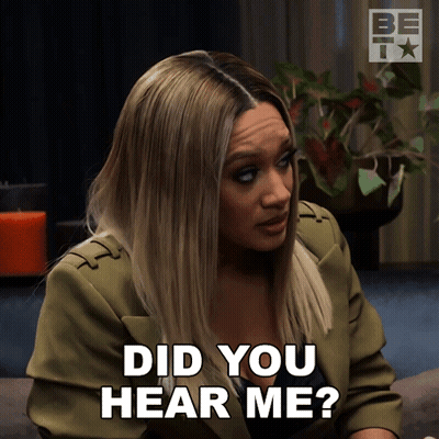 A Woman In A Green Jacket Is Asking If She Heard Her GIF
