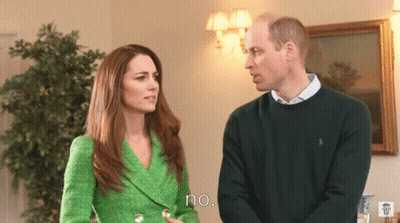 A Woman In A Green Jacket Stands Next To A Man In A Green Sweater And Says No GIF
