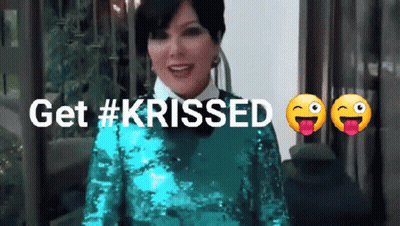 A Woman In A Green Sequined Dress With The Words Get #Krissed Below Her GIF