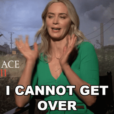 A Woman In A Green Shirt Says " I Cannot Get Over " With Her Hands In The Air GIF