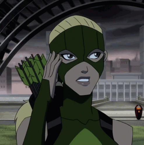 A Woman In A Green Superhero Costume Holds An Arrow GIF