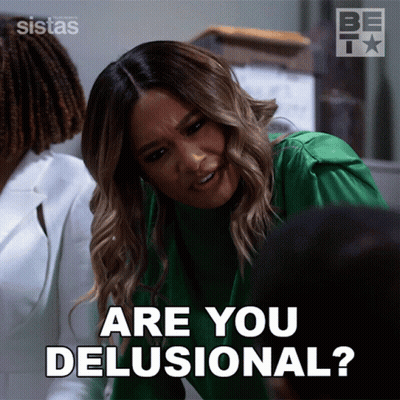 A Woman In A Green Sweater Is Asking Are You Delusional GIF