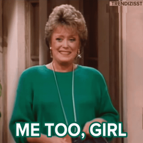 A Woman In A Green Sweater Is Smiling And Saying Me Too Girl GIF