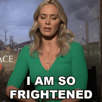 A Woman In A Green Sweater Says " I Am So Frightened " GIF