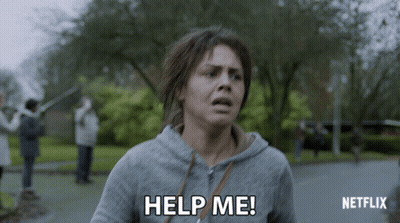 A Woman In A Grey Hoodie Is Asking For Help From Netflix GIF