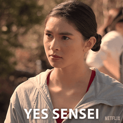 A Woman In A Grey Jacket Says Yes Sensei On The Bottom GIF