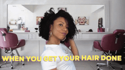 A Woman In A Hair Salon With The Words " When You Get Your Hair Done " Behind Her GIF