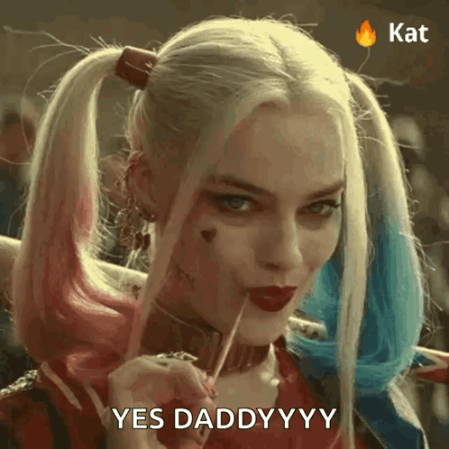 A Woman In A Harley Quinn Costume Is Holding A Lollipop And Saying Yes Daddyyyy . GIF