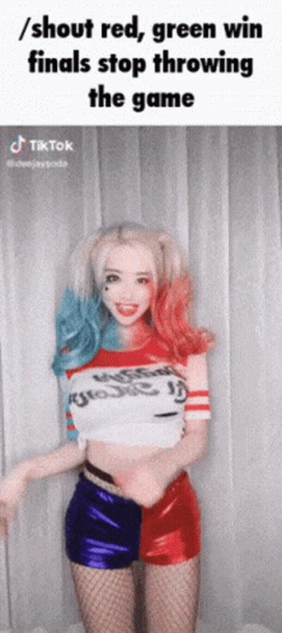 A Woman In A Harley Quinn Costume Is Throwing A Game GIF