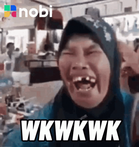 A Woman In A Hijab Is Laughing With The Words Wkwwkwk On The Bottom GIF
