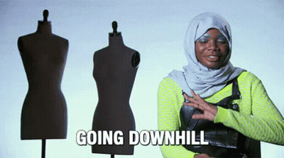 A Woman In A Hijab Is Standing In Front Of Mannequins And Says Going Downhill GIF