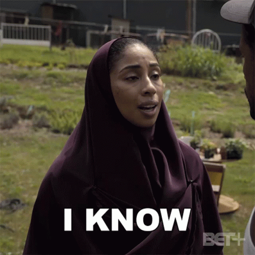 A Woman In A Hijab Says " I Know " In Front Of A Man GIF