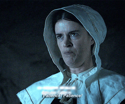 A Woman In A Hooded Cape Says Patience GIF