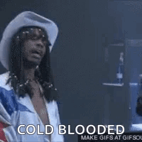 A Woman In A Hooded Jacket Is Laughing And Talking To A Man . GIF