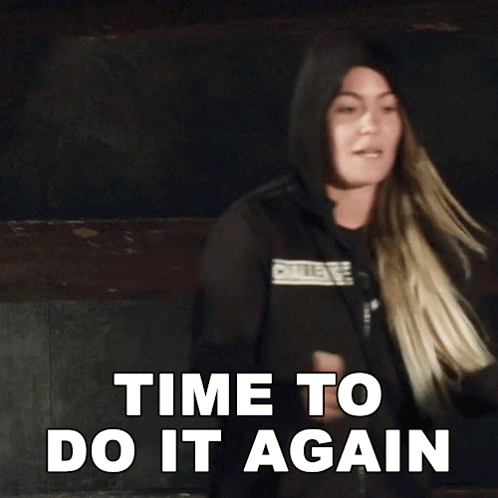 A Woman In A Hooded Jacket Says " Time To Do It Again " GIF