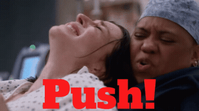 A Woman In A Hospital Bed With The Word Push On The Bottom GIF
