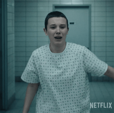 A Woman In A Hospital Gown With A Netflix Logo Behind Her GIF