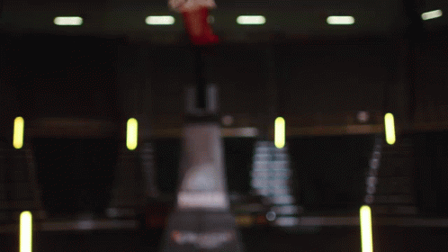 A Woman In A Iowa Jersey Looks At The Camera GIF