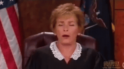 A Woman In A Judge 'S Chair With Her Eyes Closed GIF