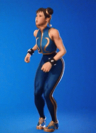 A Woman In A Karate Uniform Is Standing On A Blue Background . GIF