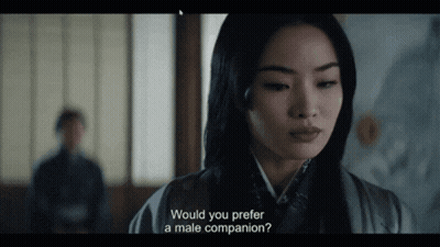 A Woman In A Kimono Is Asking If She Would Prefer A Male Companion GIF