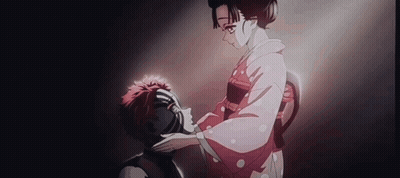 a woman in a kimono is putting her hand on a man 's forehead .