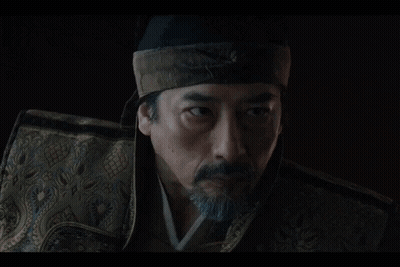 A Woman In A Kimono Kneels In Front Of A Man GIF